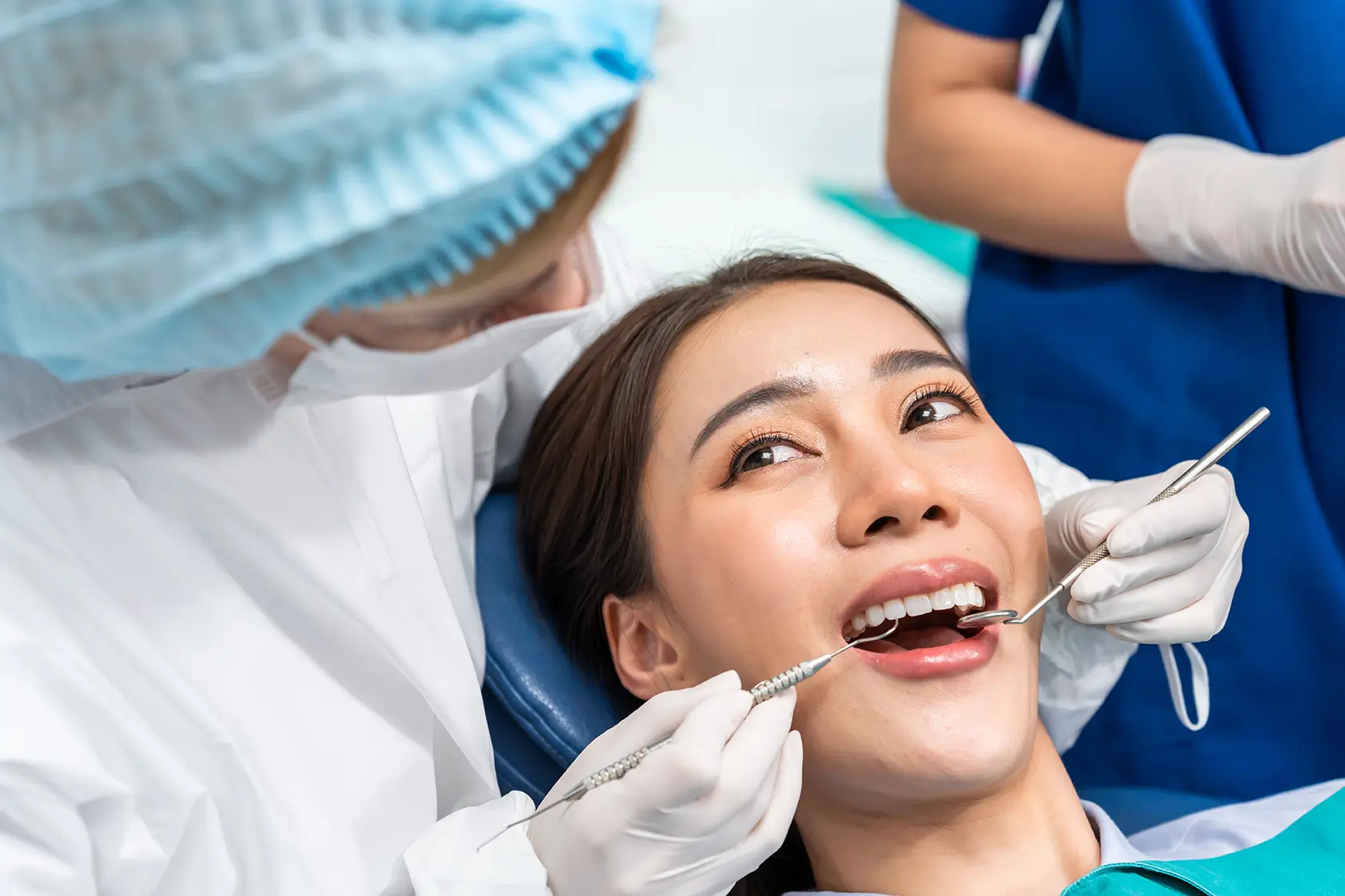 Woman getting her teeth checked by a dentist