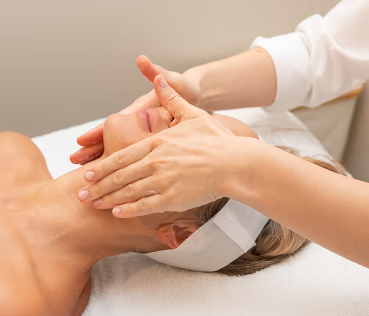 Close-up of a professional facial massage technique performed on a client