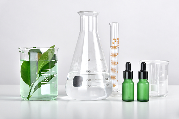 Skincare ingredients and laboratory glassware used in cosmetic formulations