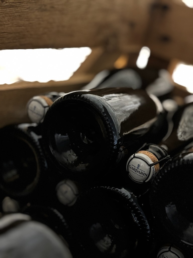Close-up of chalk cliffs showing layers of light chalk and darker soil bands.