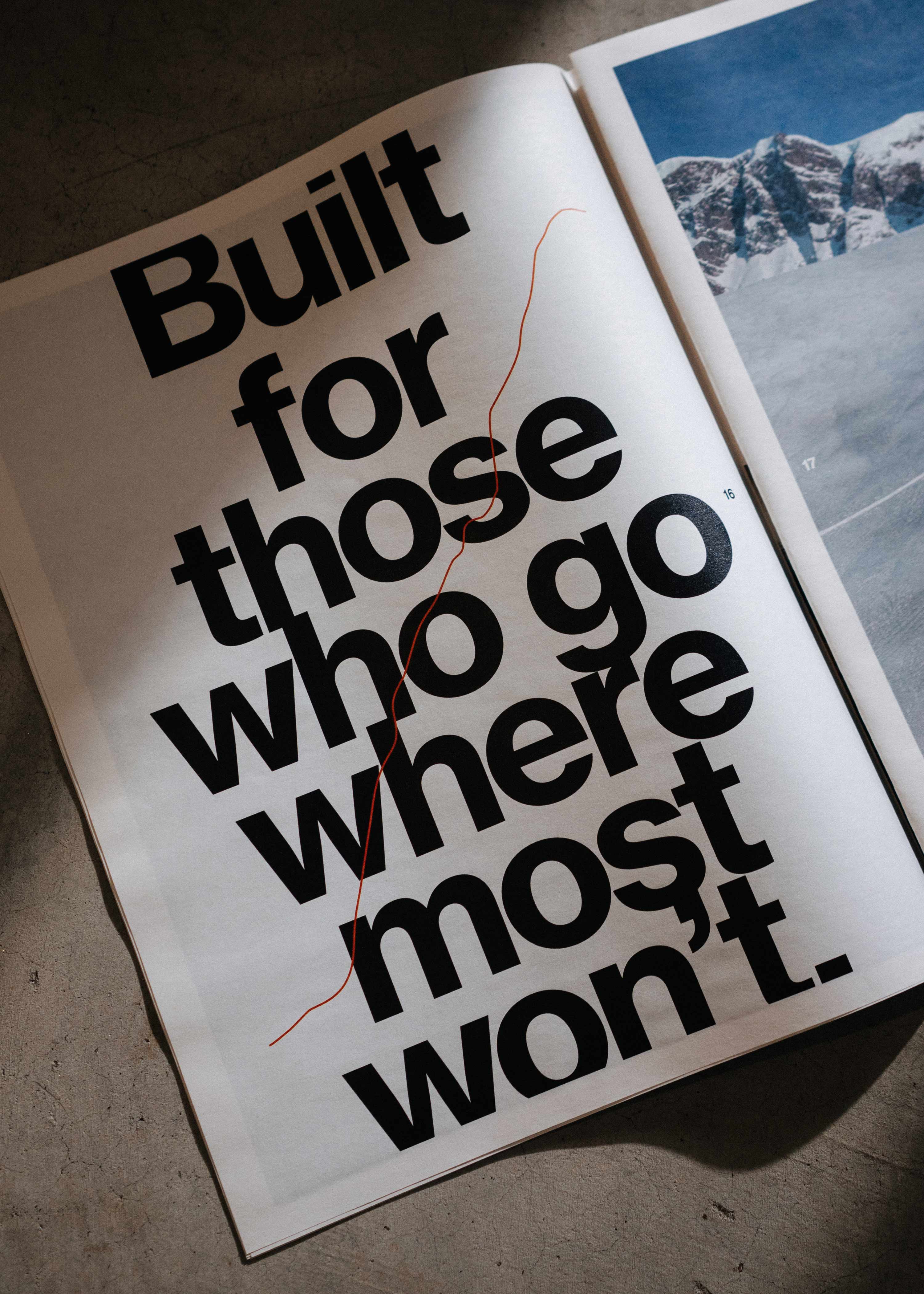 An open magazine page with bold text reading: Built for those who go where most won't.