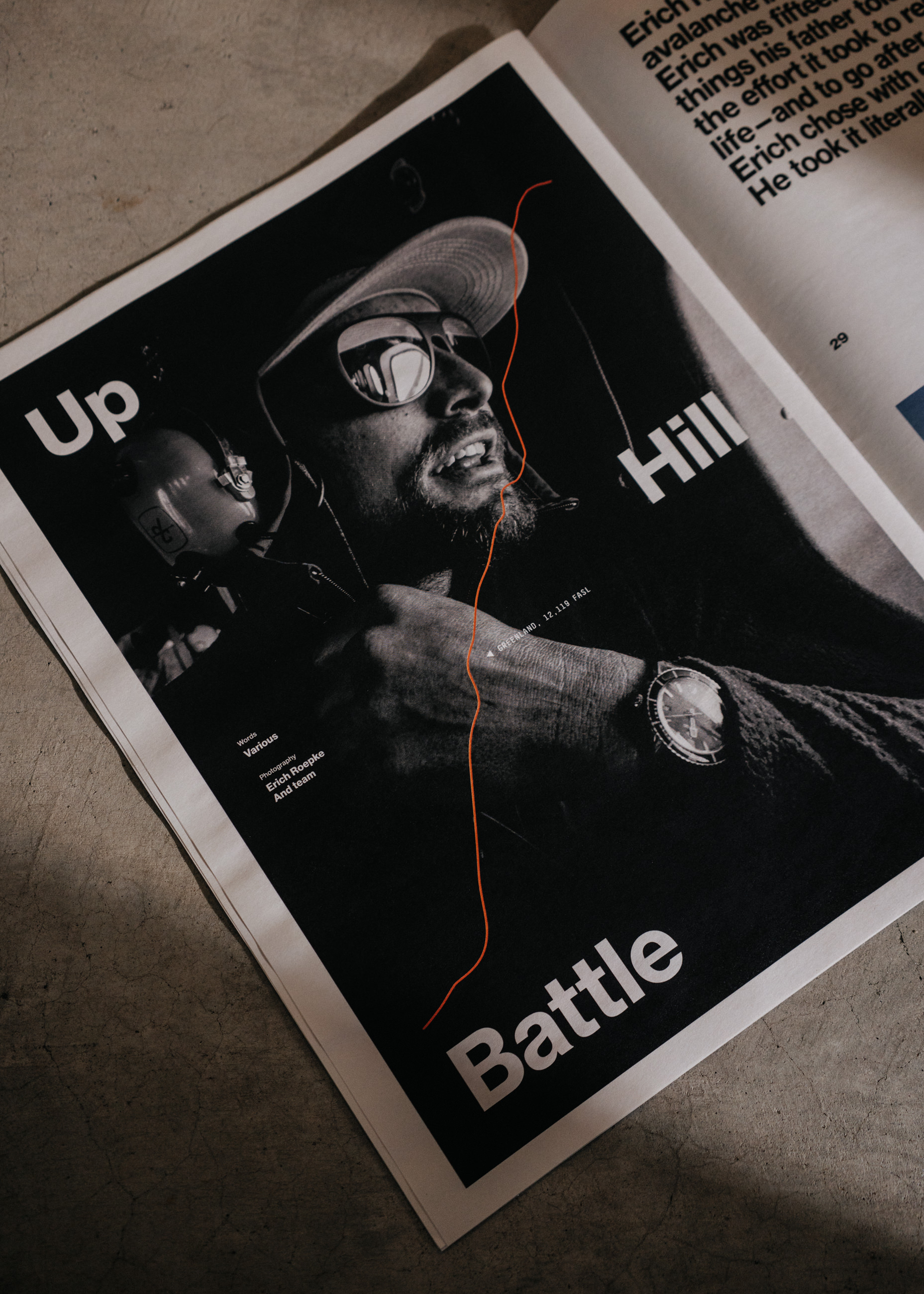Magazine page with a black-and-white photo of a man wearing sunglasses and a hat titled 'Up Hill Battle'.