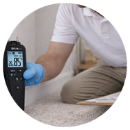 Man using moisture meter tool