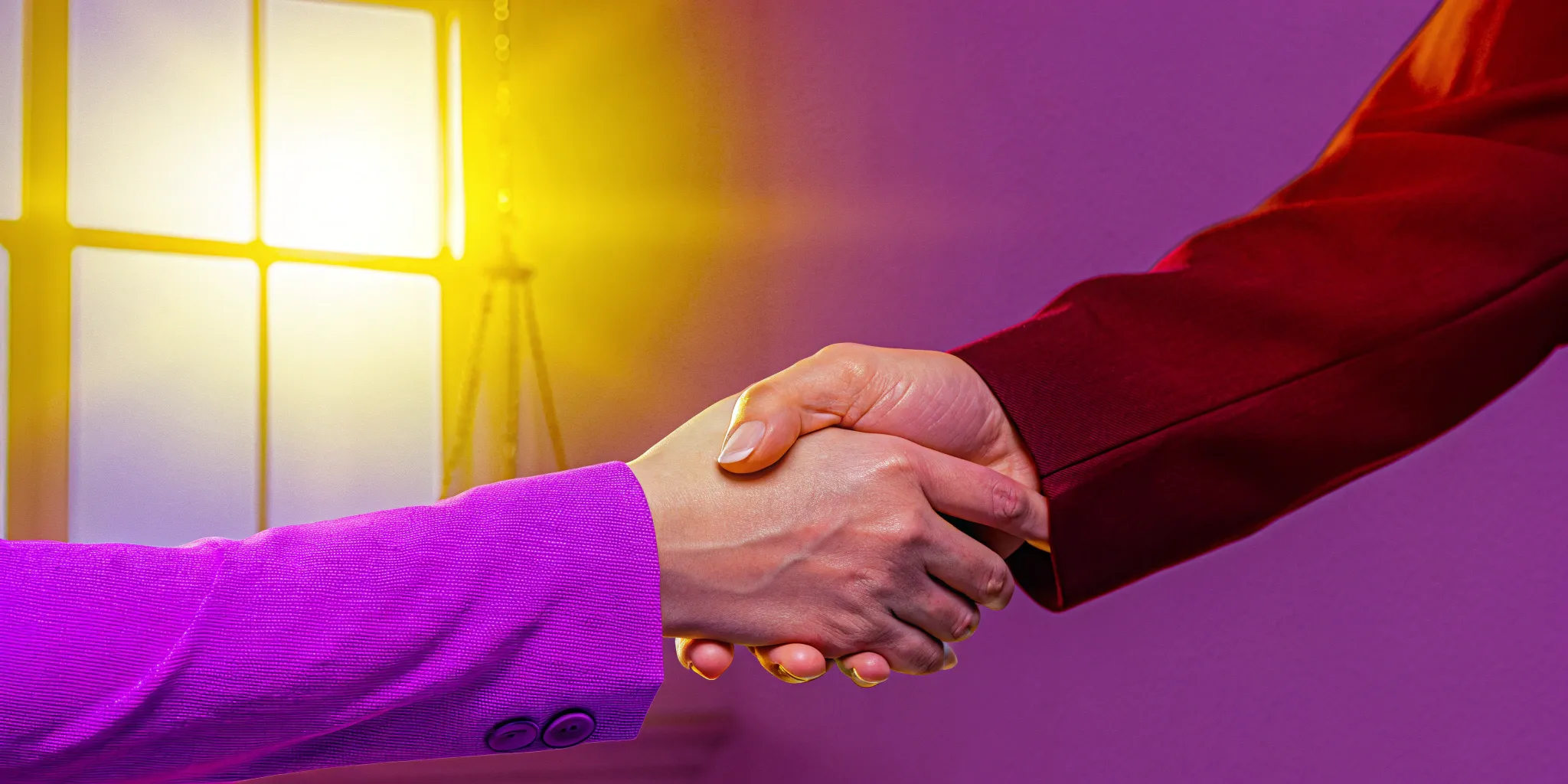 A handshake finalizing a settlement agreement for how much an injury case is worth.