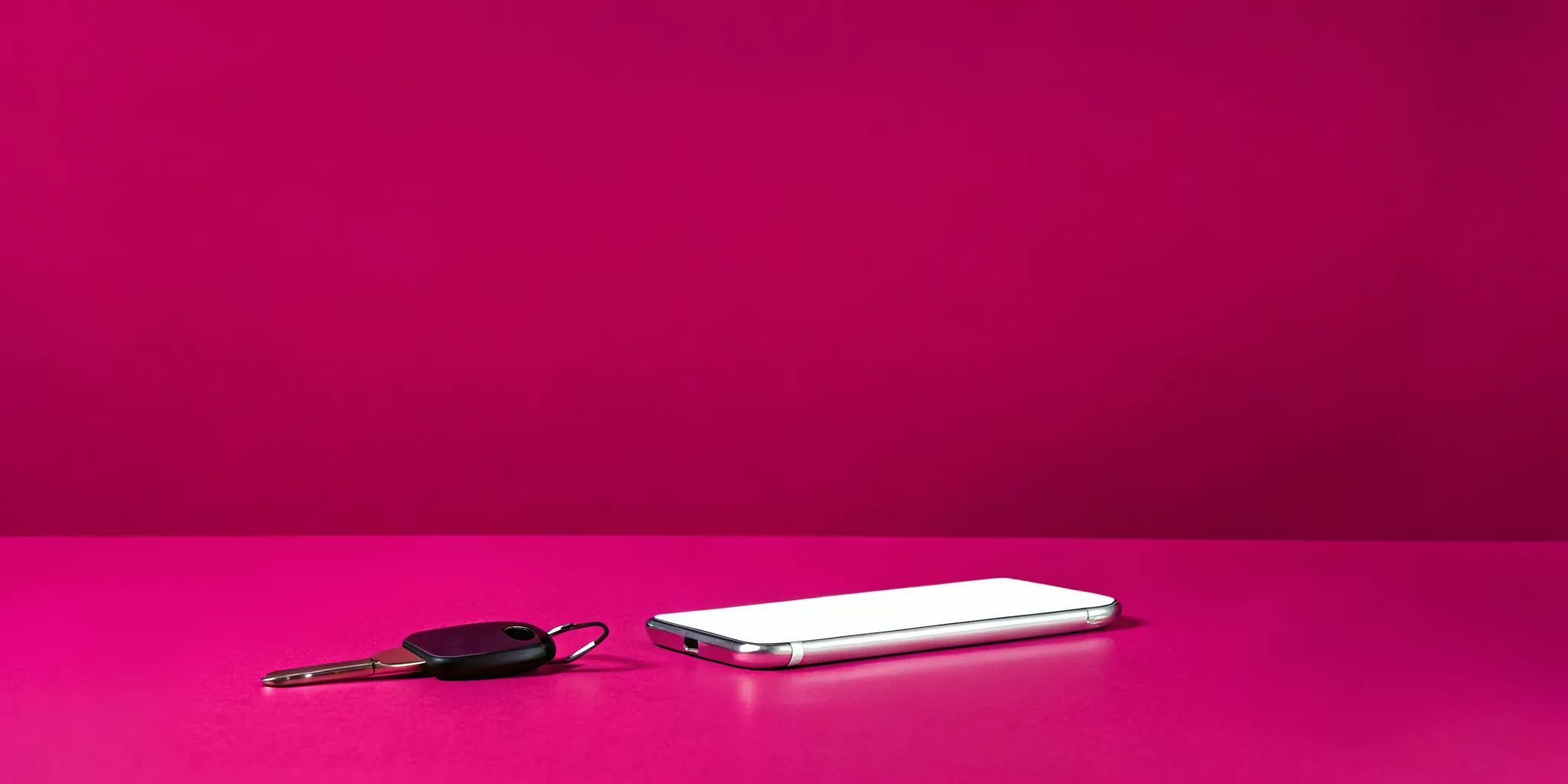 Phone and car keys beside materials used to investigate distracted driving