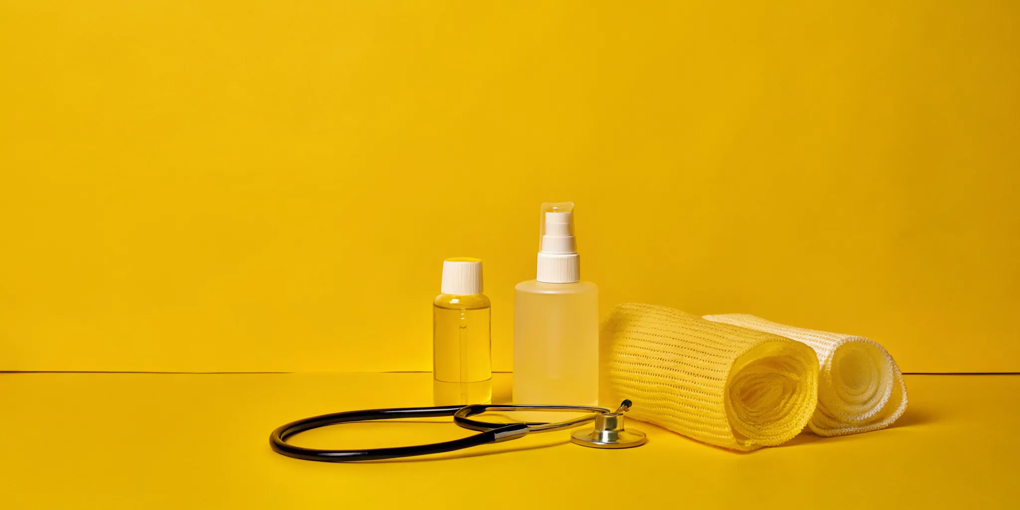 First-aid medical supplies including sterile gauze, bandages, and medical tools for treating road rash friction burns