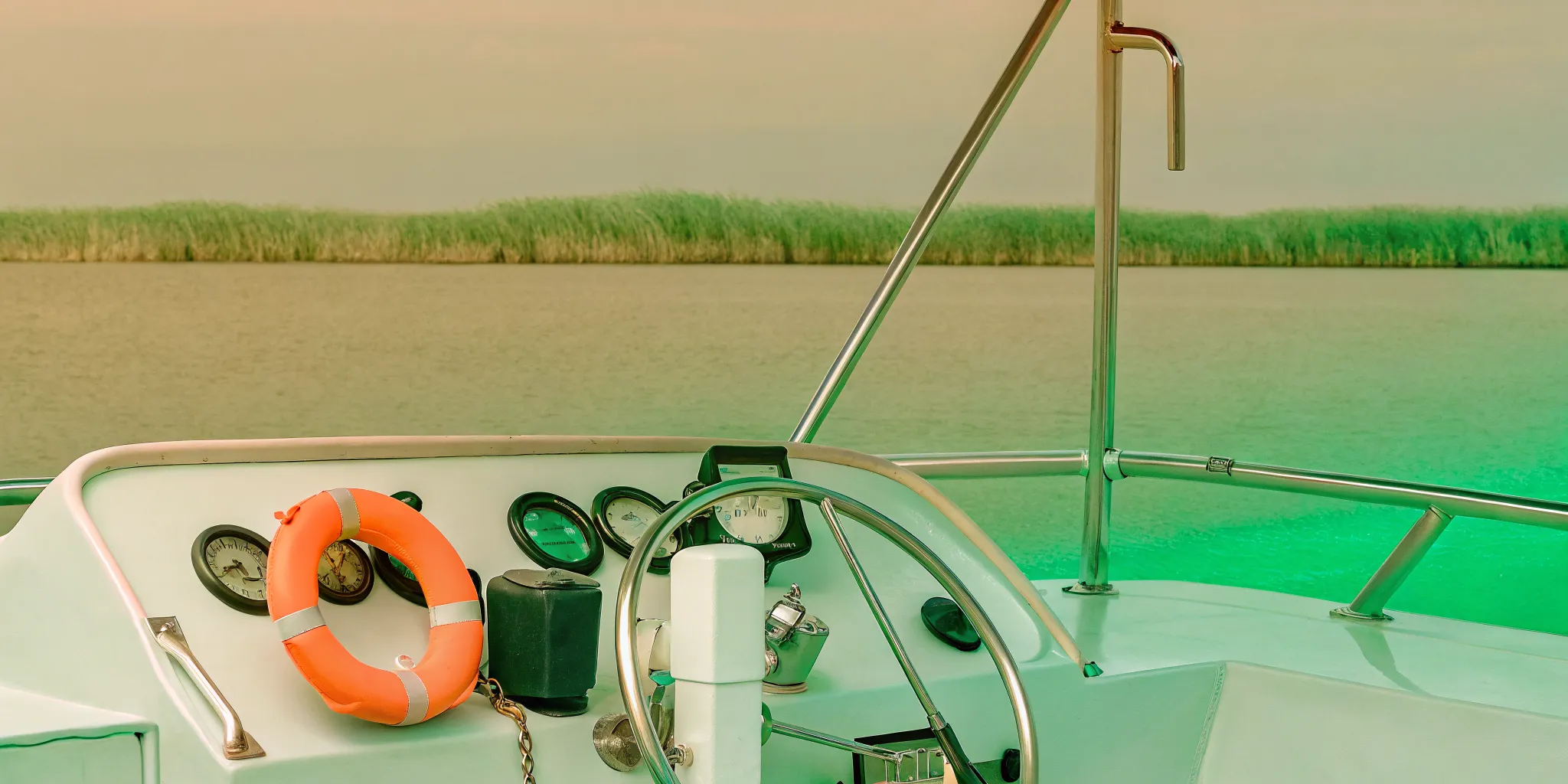 Boat steering wheel and navigation instruments on a coastal Georgia watercraft