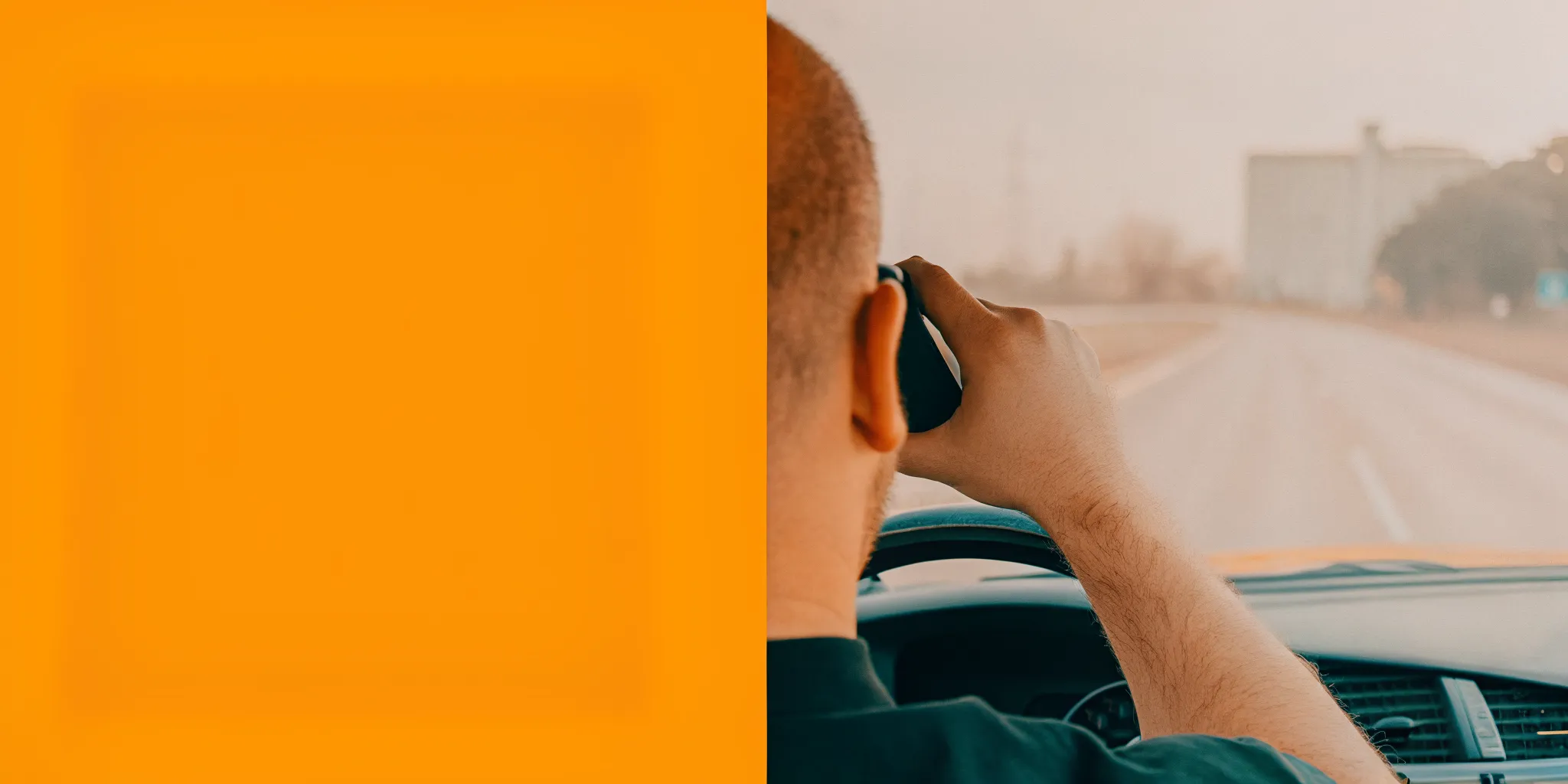 Driver setting down a phone and focusing on a Savannah road ahead