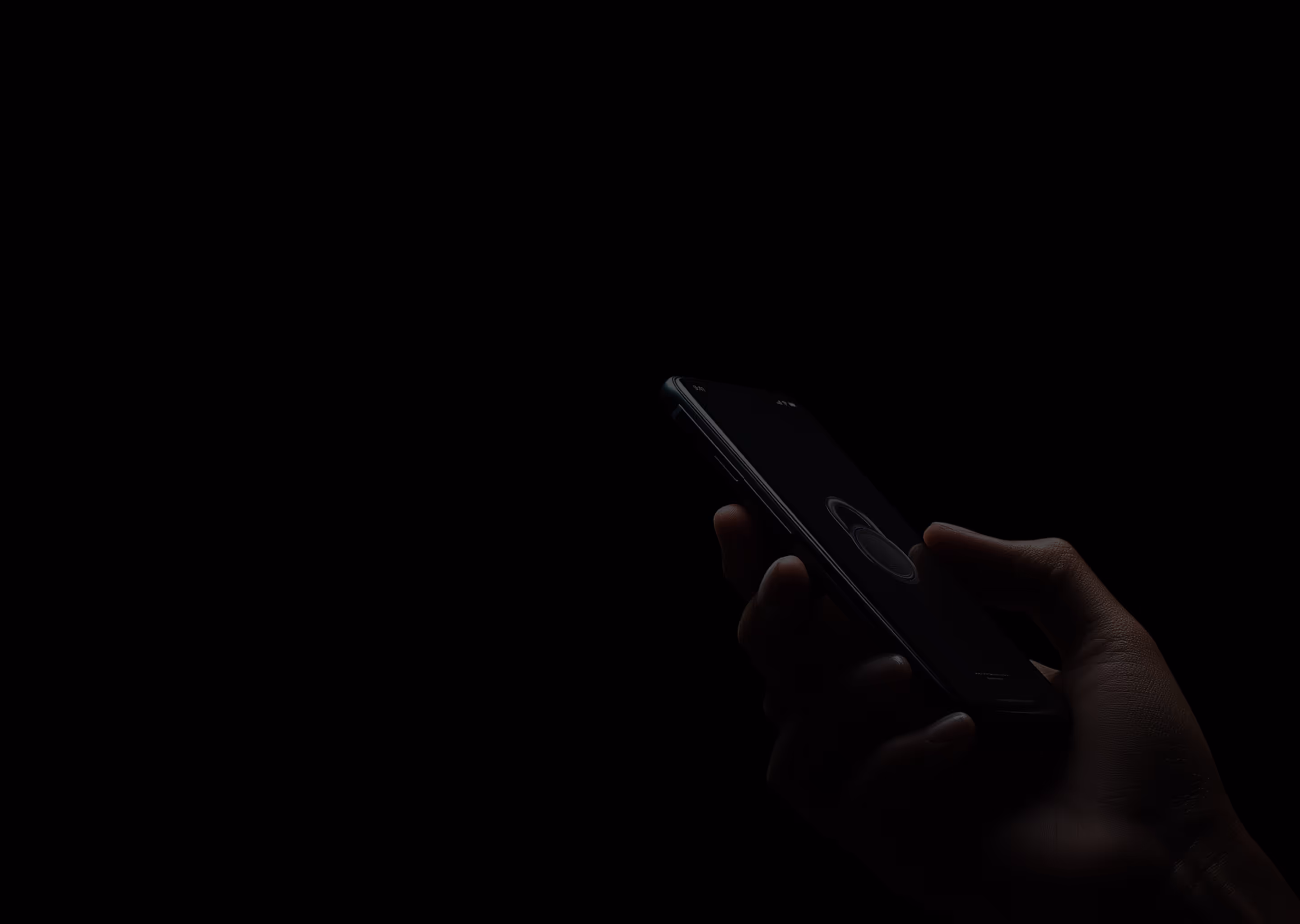 Hand holding a smartphone with a visible fingerprint icon on the screen, indicating biometric authentication.