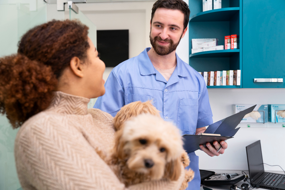 Veterinary team consulting with a pet owner while gently examining a cat or dog, demonstrating care and professionalism