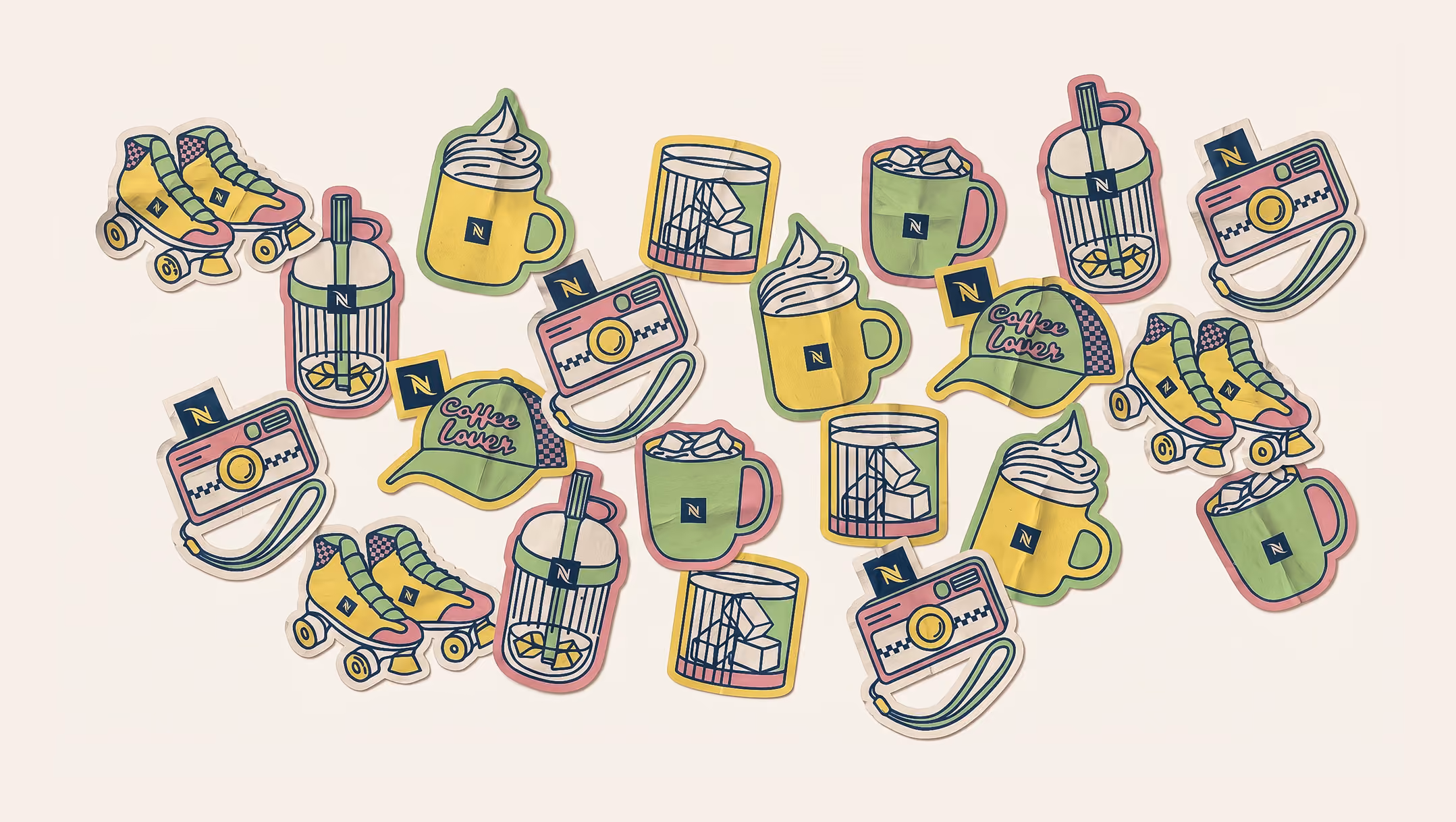 Colorful stickers of roller skates, coffee mugs, cameras, lemon drinks, and hats with 'Coffee Lover' text.
