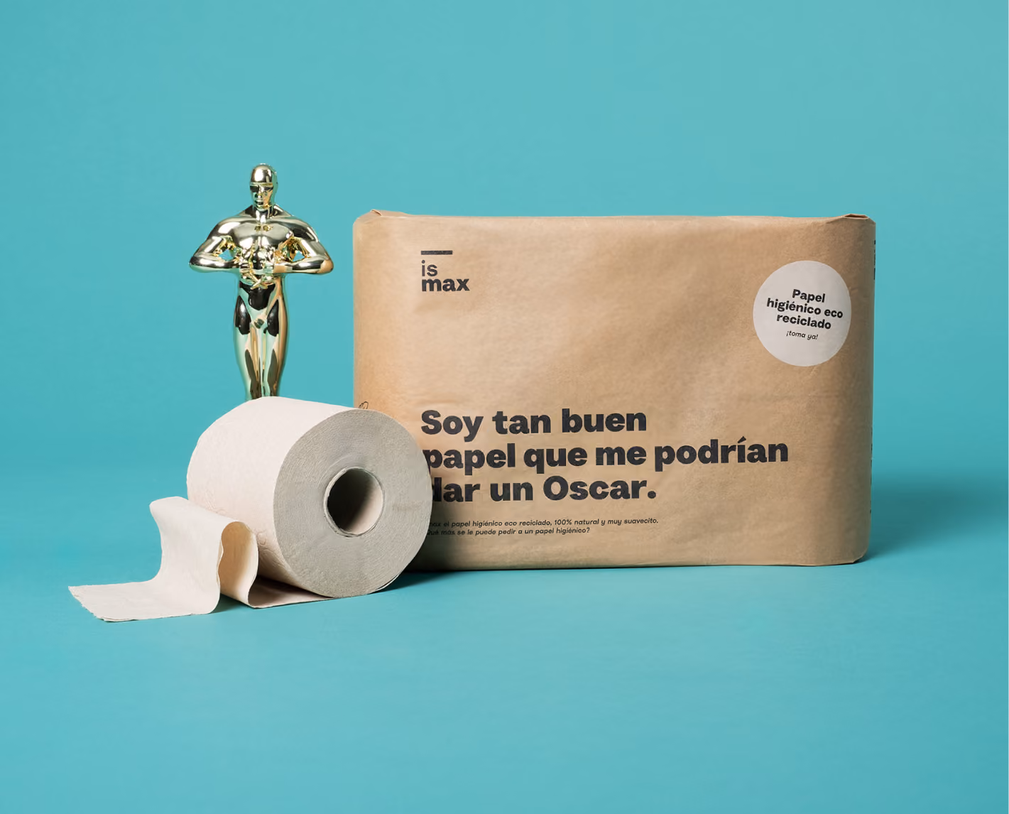 Package of eco recycled toilet paper with a roll and a small gold Oscar-like trophy beside it.