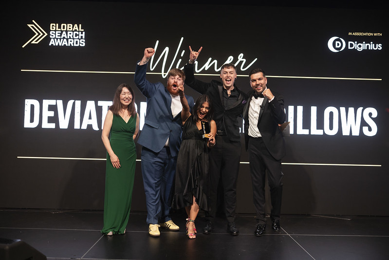 Deviation celebrate their Global Search Award in on stage at the GSA Ceremony.