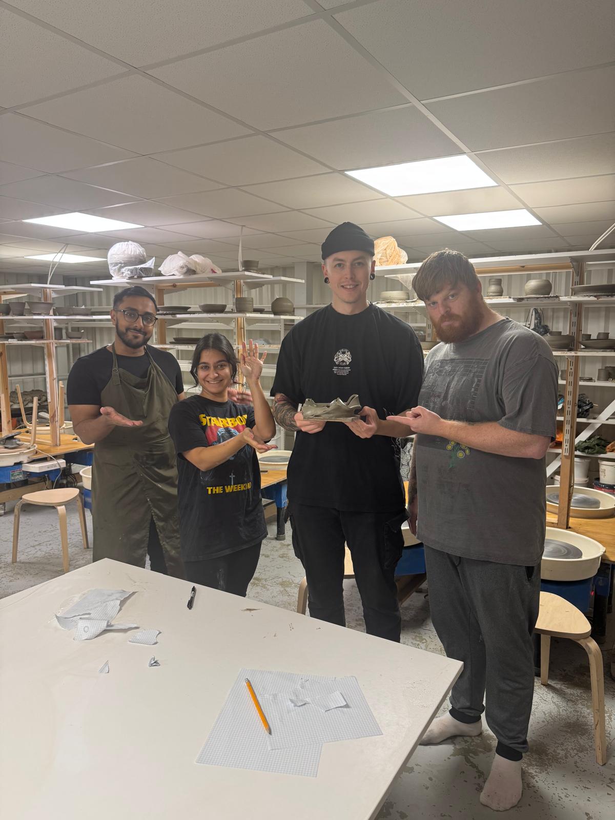 Deviation enjoy a pottery team day.