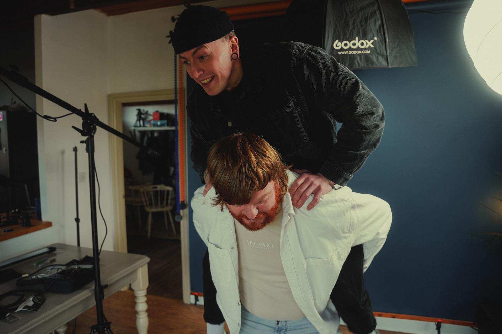 Ashley and Sam pose but it goes wrong and Sam nearly falls off Ashley's back.