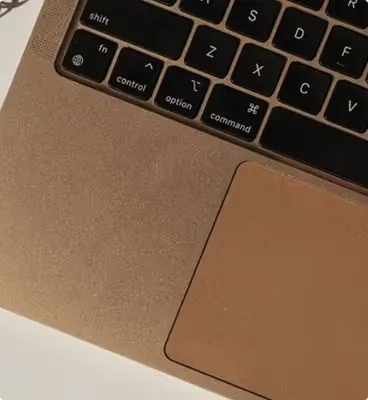 Executive Essentials service showing a laptop and organized workspace for daily operations