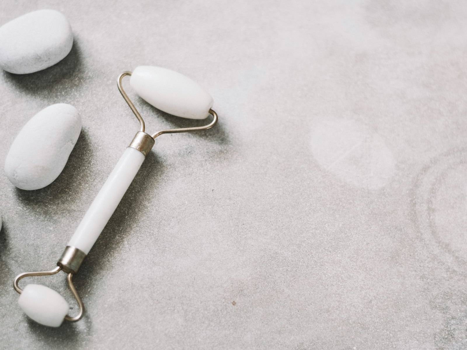 A white facial massage device