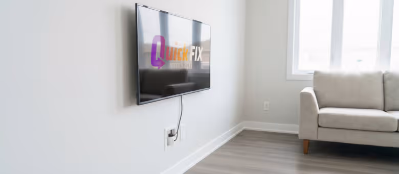 Professional residential TV wall mounting in Calgary, featuring a sleek flat-screen television perfectly mounted with clean, hidden cable management in a modern living room. | Quickfix Handyman Inc.