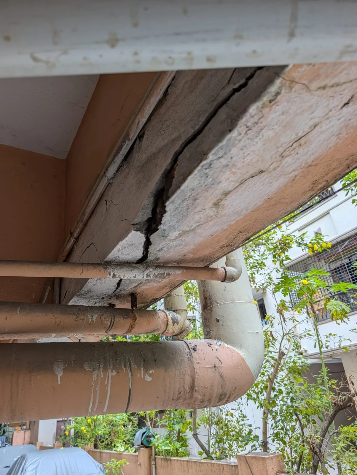 Ceiling crack exceeding 5mm with falling concrete and rusted steel — Adyar Chennai structural repair
