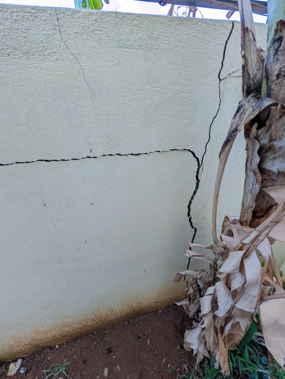 Cracked and leaning compound wall requiring structural repair in Velachery, Chennai