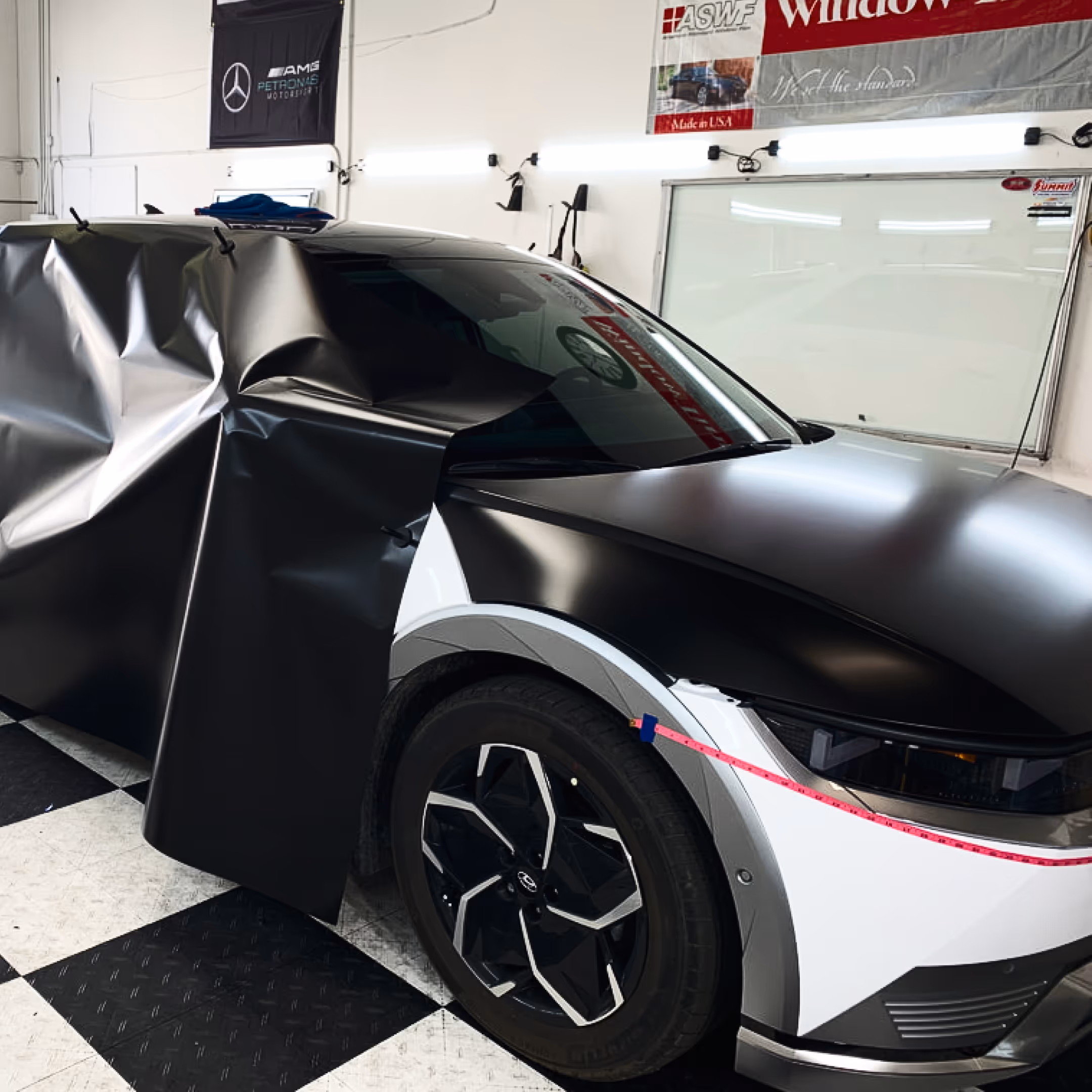 A car in the wrap process.