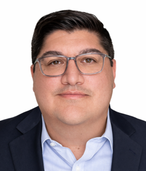 Headshot of a man with short dark hair, wearing glasses, a dark suit jacket, and a light blue shirt.