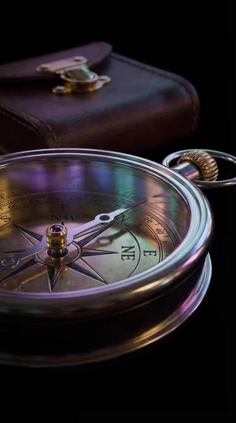 Close-up of a vintage compass with a leather case in the background on a black surface.