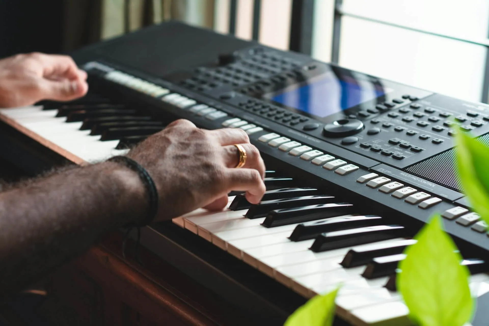 A male playing the keyboard