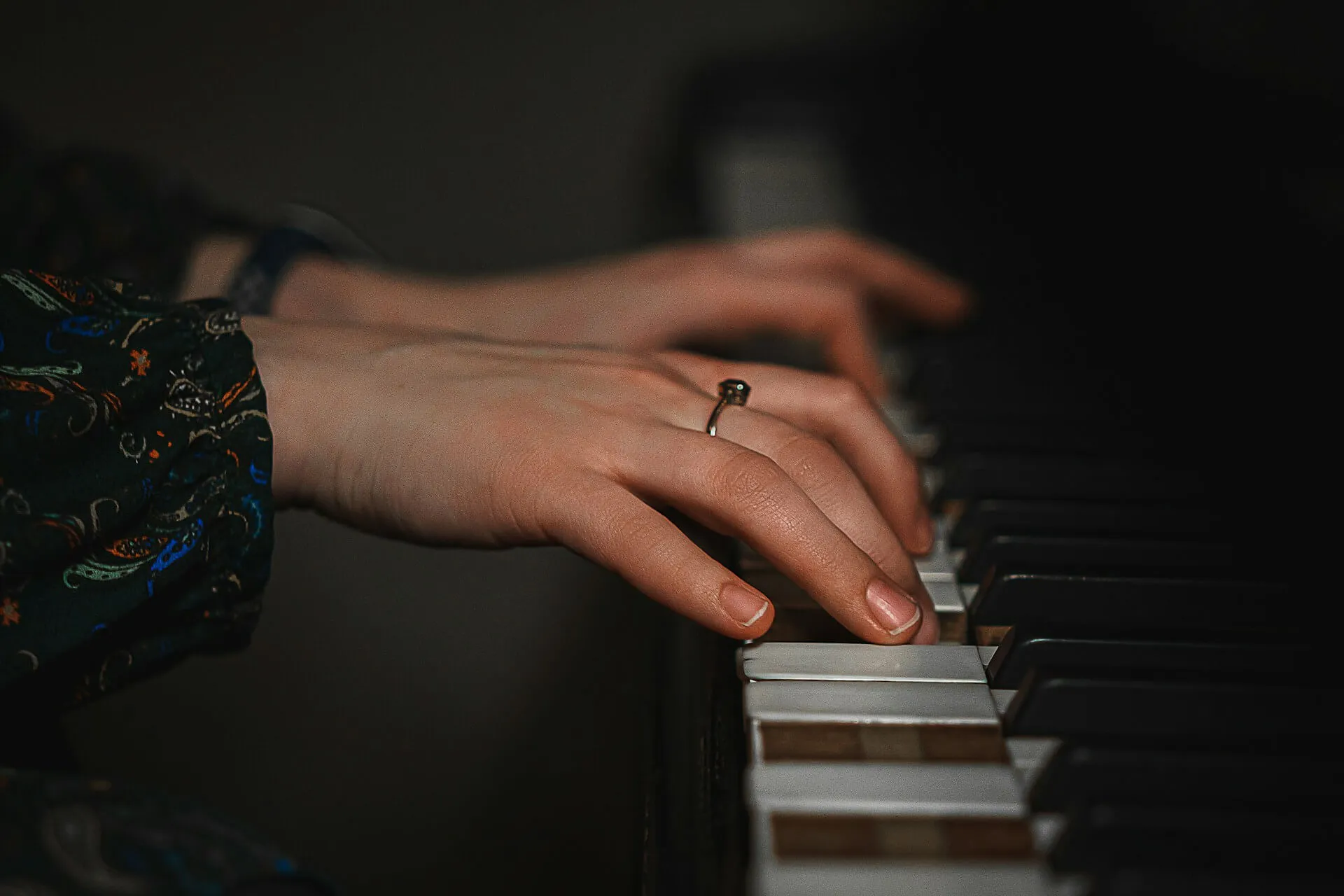 A female practising with a piano