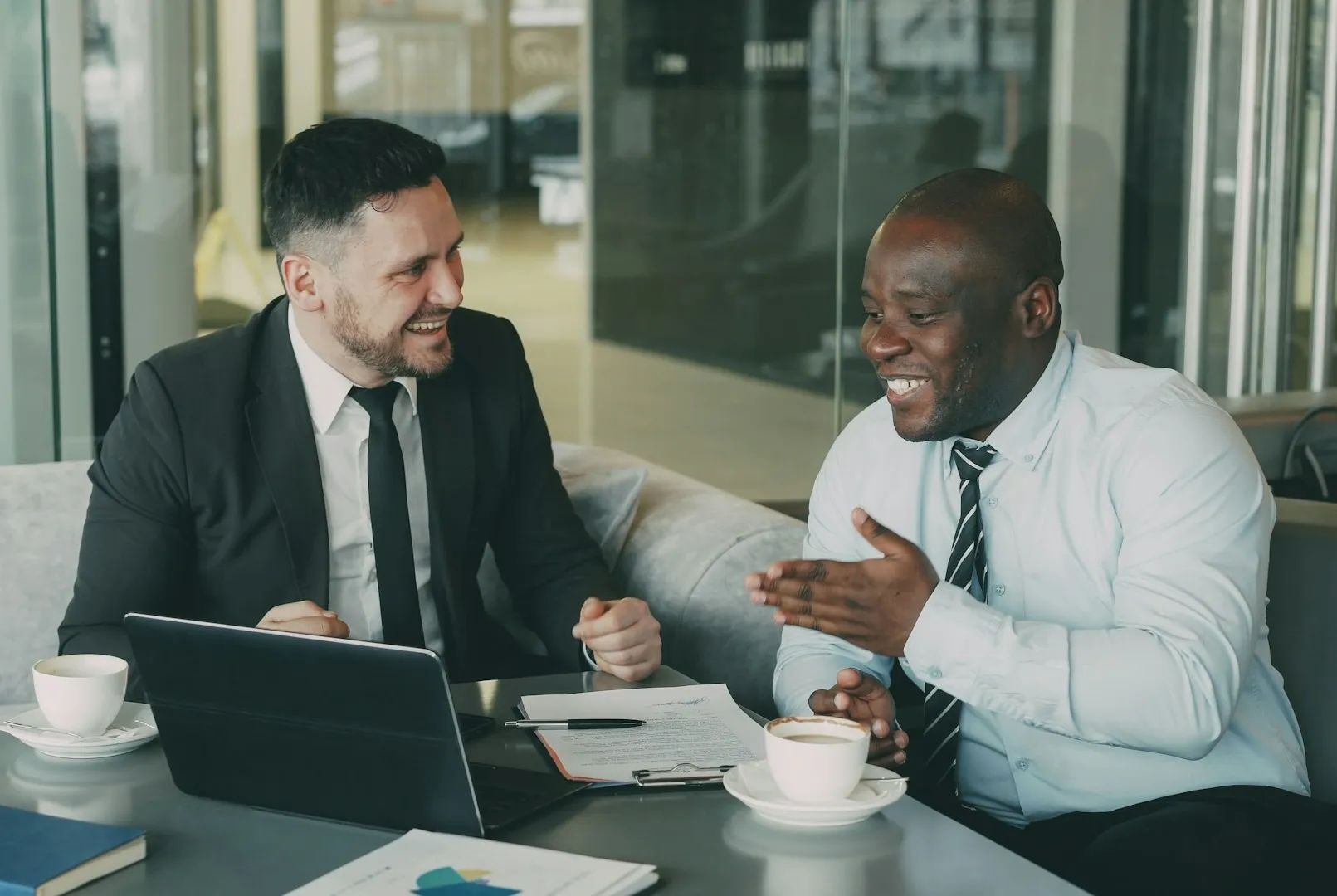 Colleagues sharing a thoughtful conversation at work