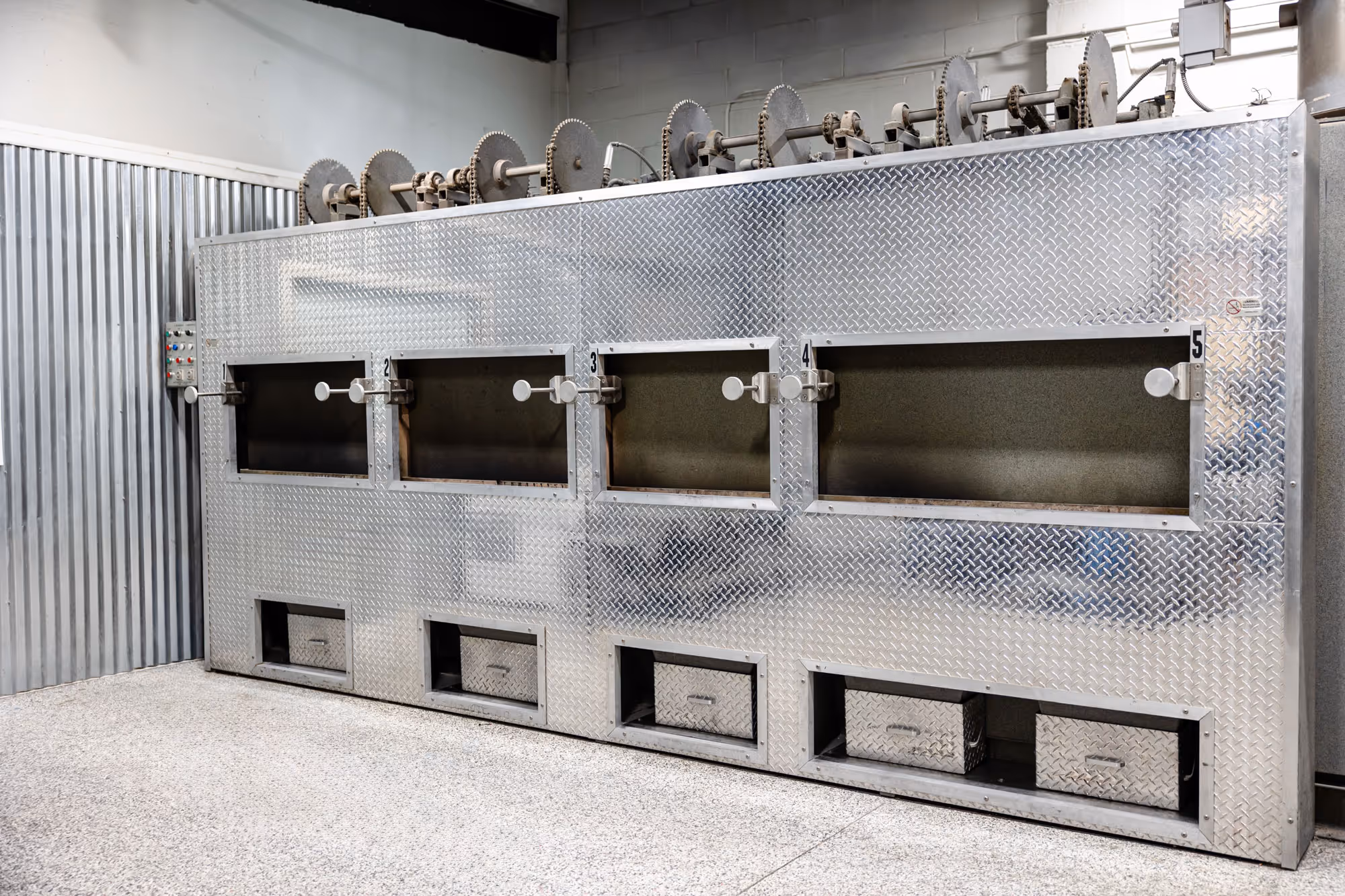 Multi-chamber animal cremation unit inside a clean, professional crematory facility.