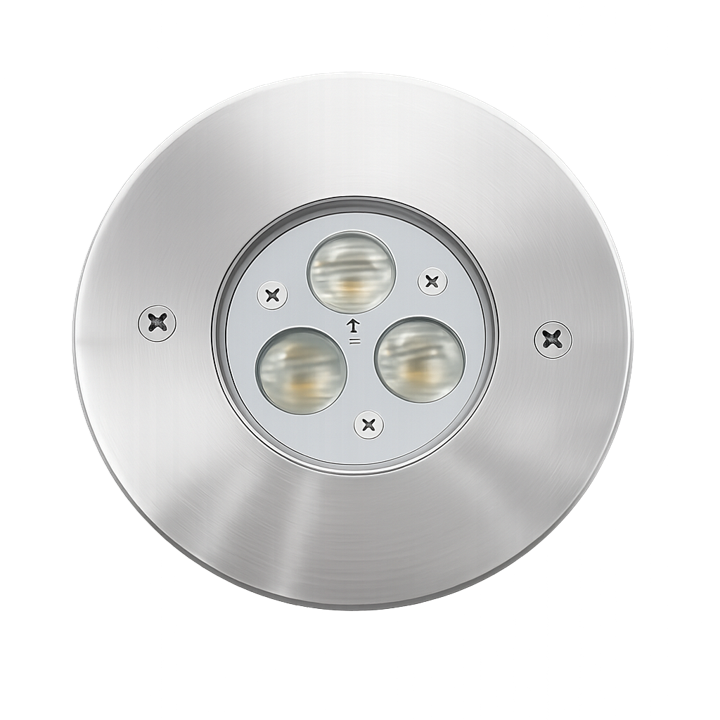 Ground-recessed luminaires projecting upward light to highlight façades, trees, and architectural elements.