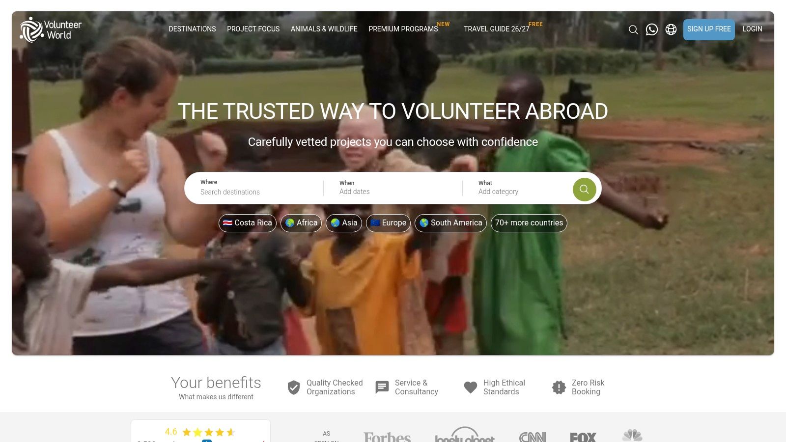 A volunteer interacting with children in a classroom setting.