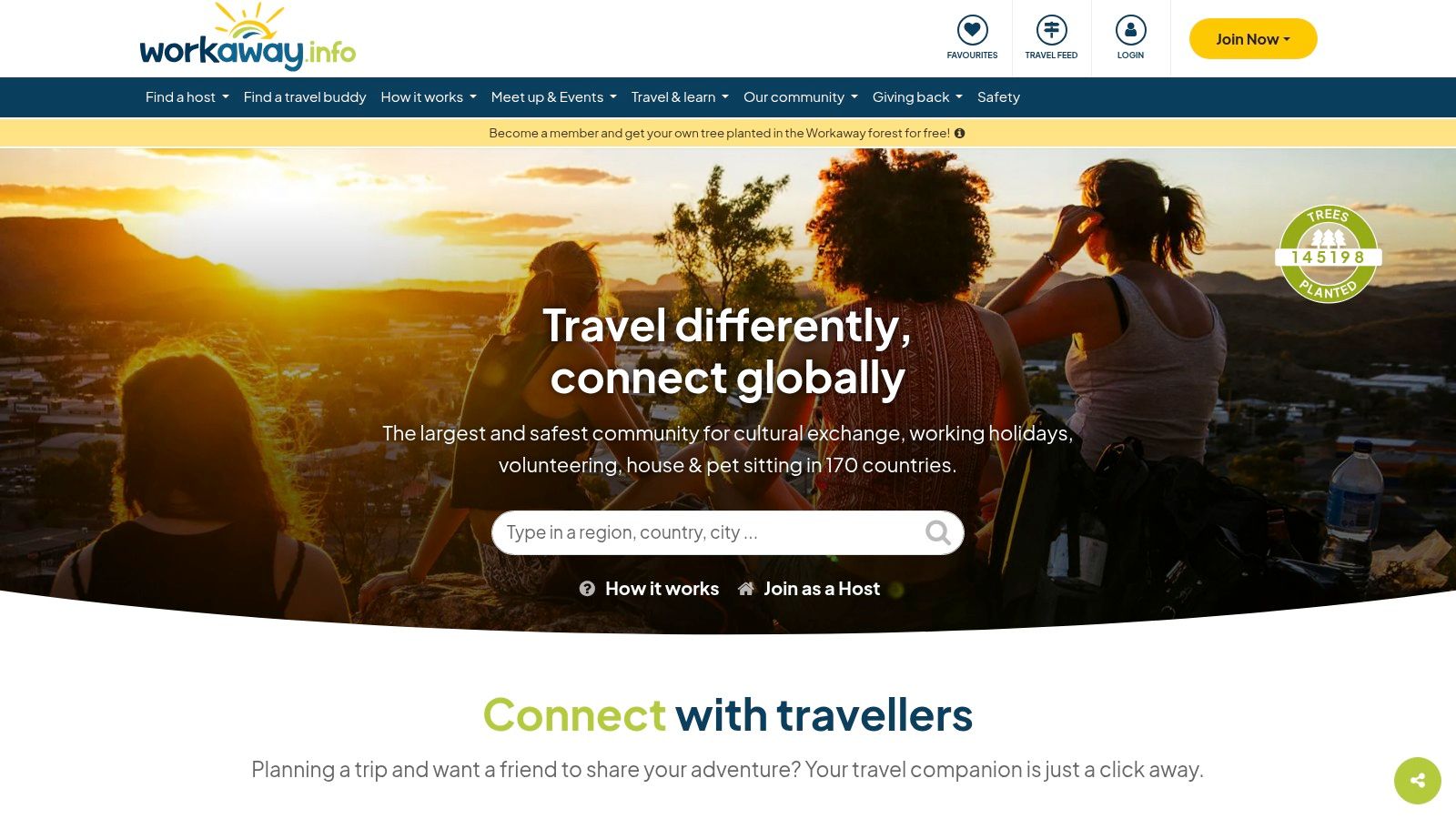 A traveler sitting on a rock overlooking a stunning landscape, representing the freedom of Workaway.