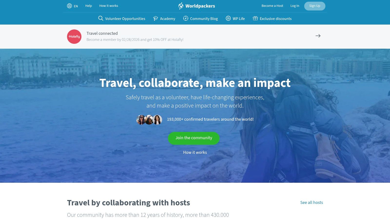 A solo traveler enjoys a scenic view, representing the freedom of work-exchange programs.