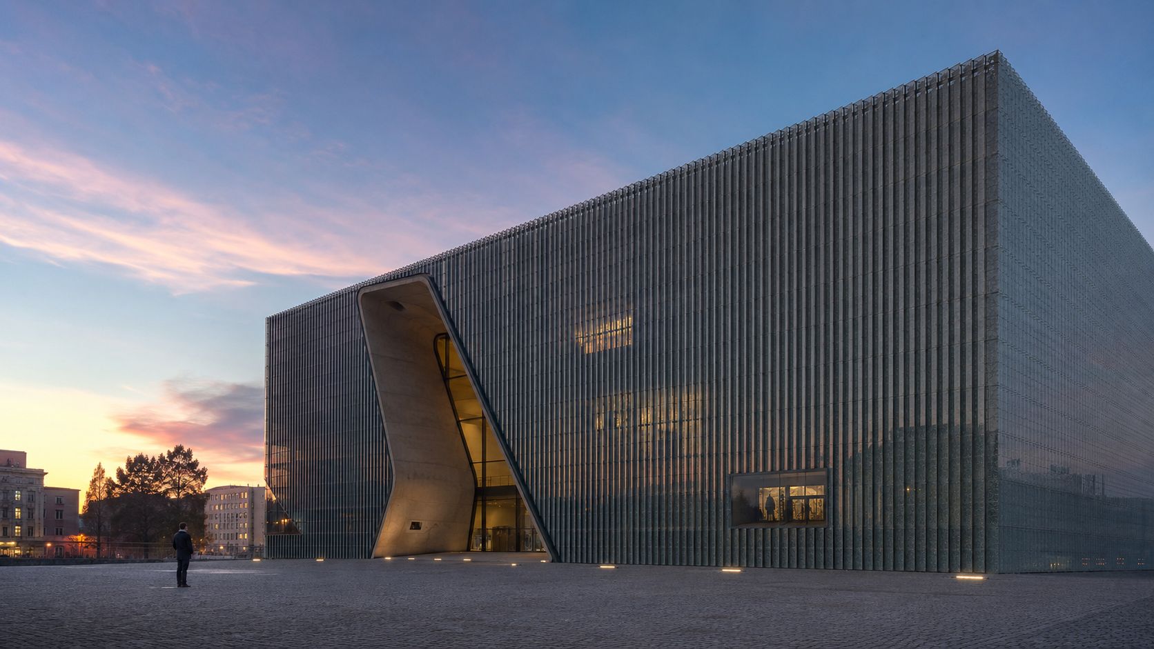 The Polin Museum of the History of Polish Jews standing at dusk in Warsaw, Poland.