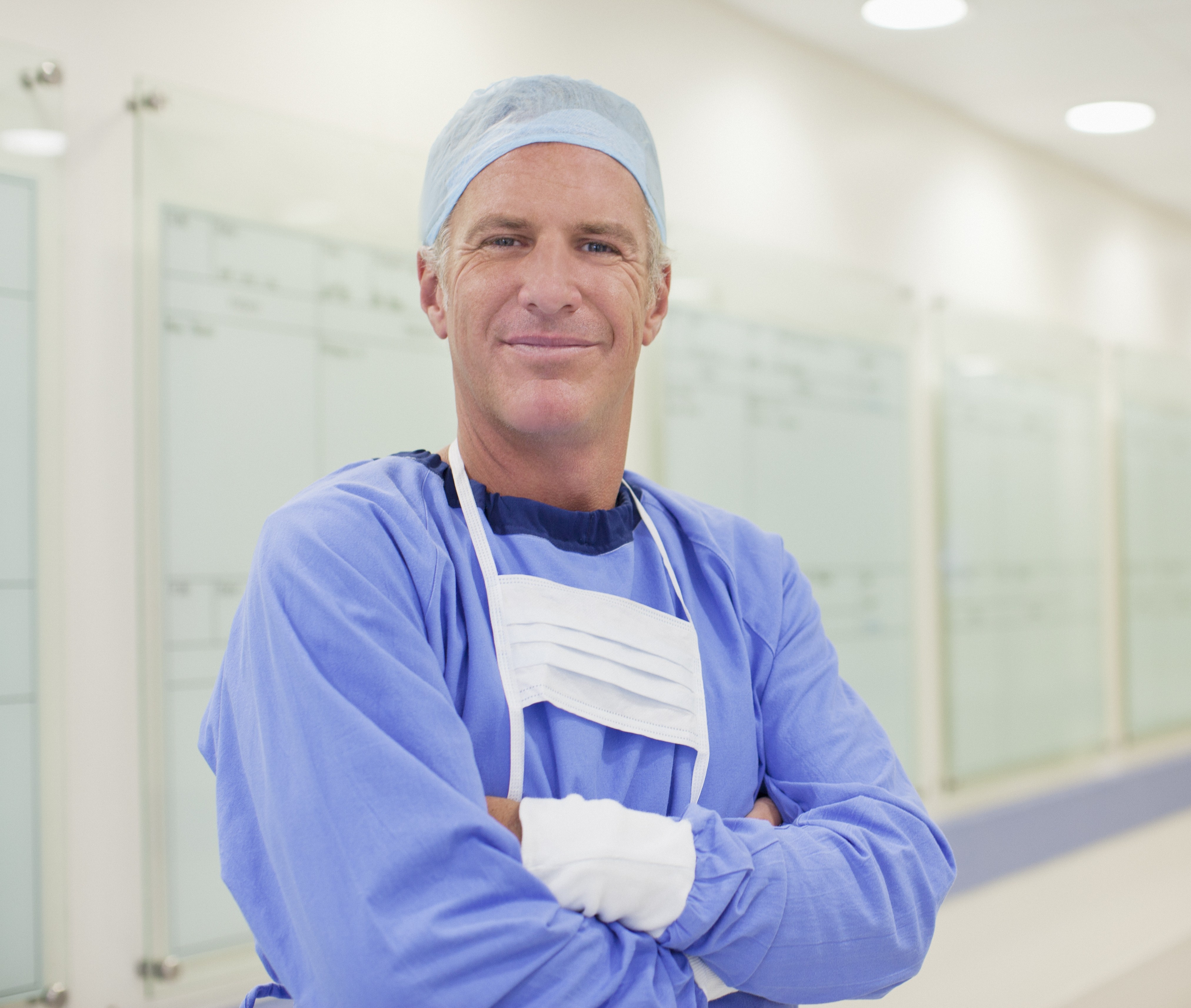 Male surgeon smiling before surgery 