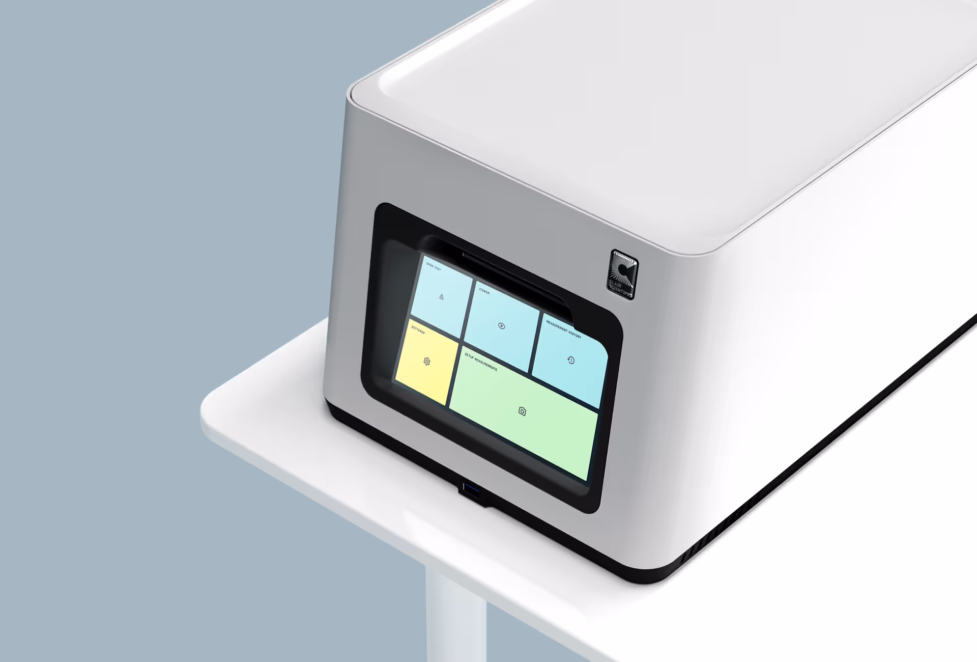 White scientific device with a touchscreen displaying colorful menu tiles, placed on a white stand.