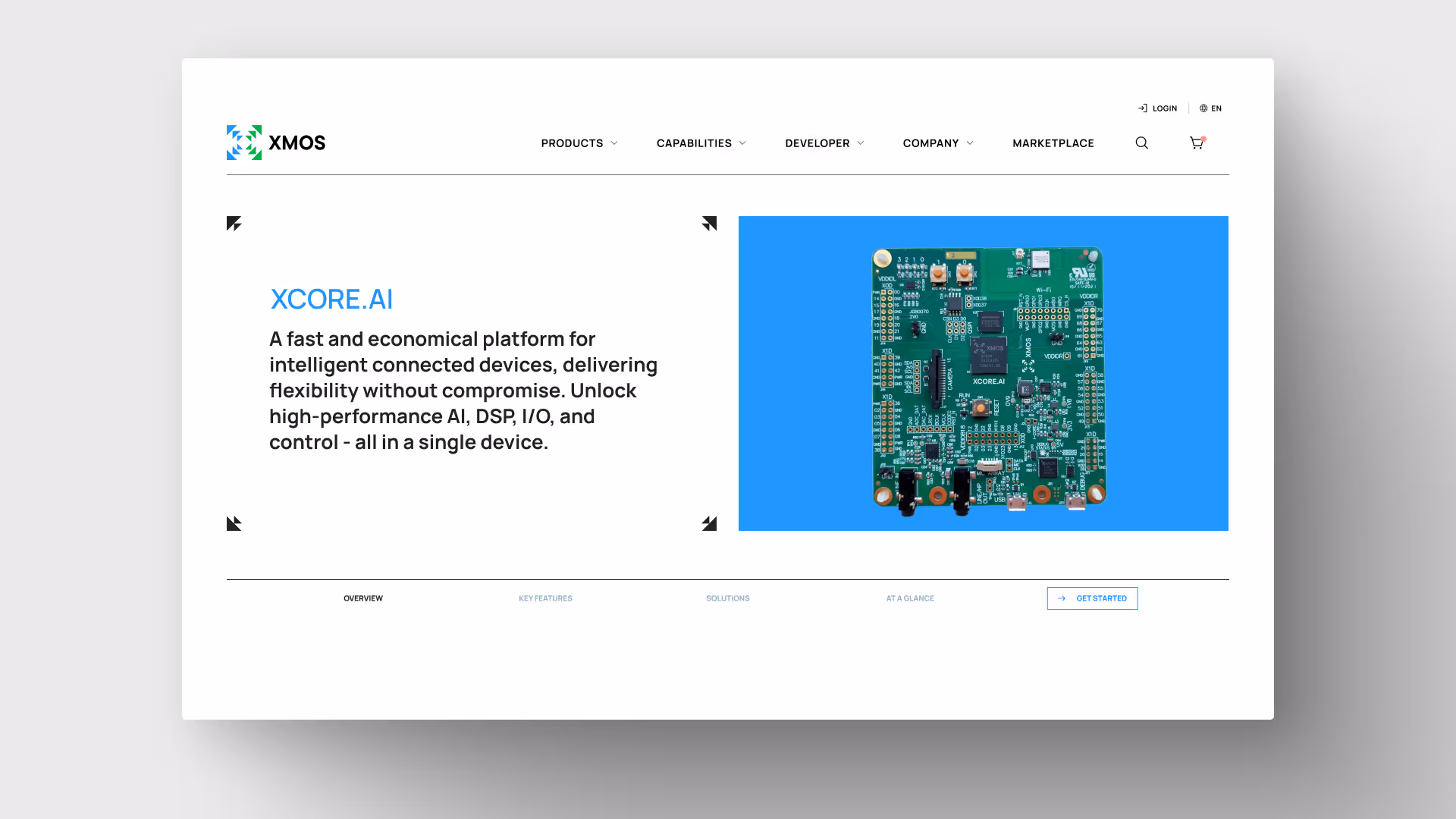 Website page showing XMOS XCORE.AI product with description and image of a green circuit board on blue background.
