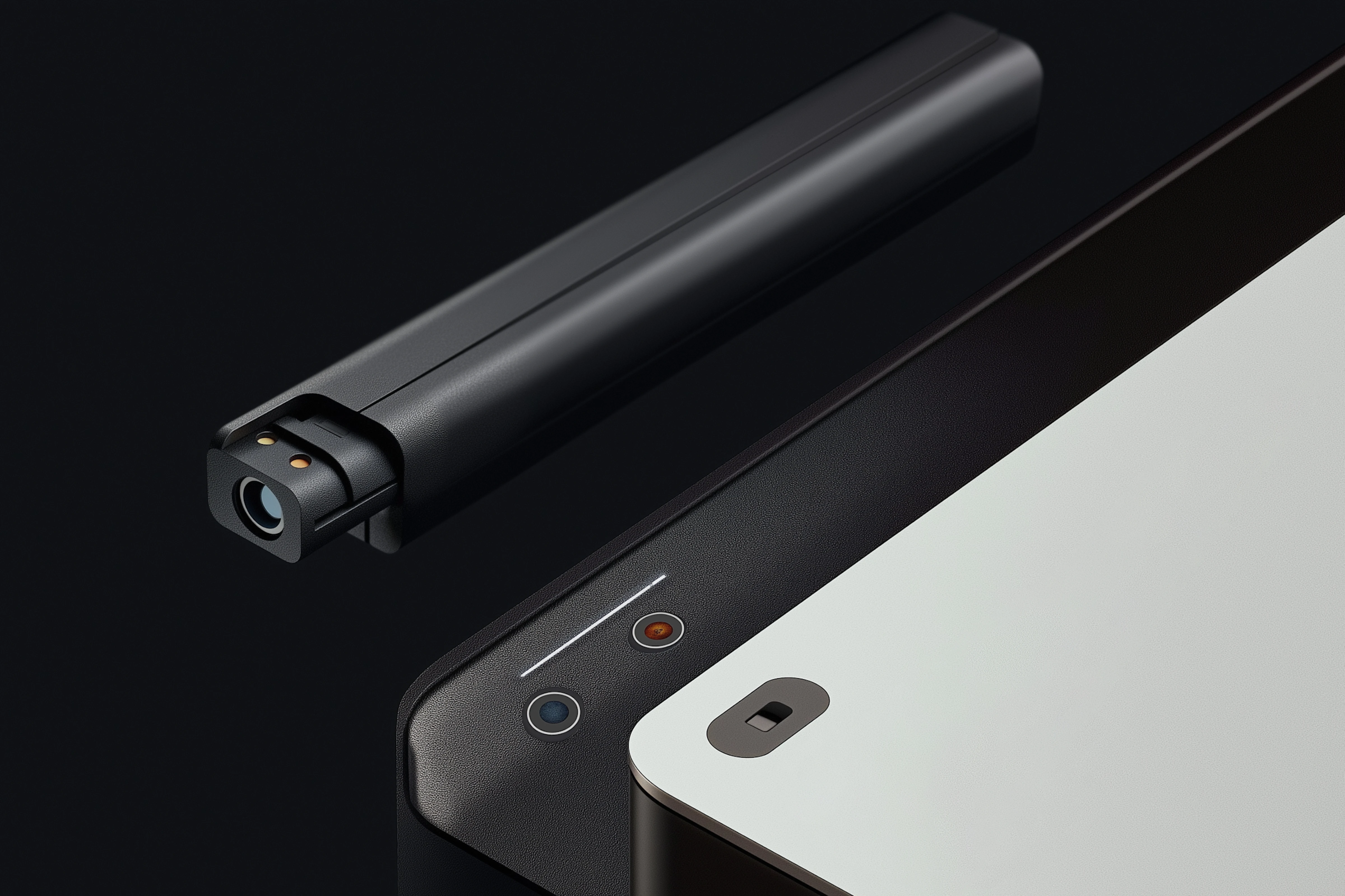 Close-up of a sleek black electronic device with a small camera lens and indicator lights.