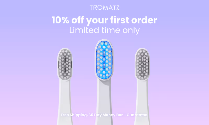 Social ad including three electric toothbrush heads against a purple gradient background with text offering 10% off first order and free shipping.