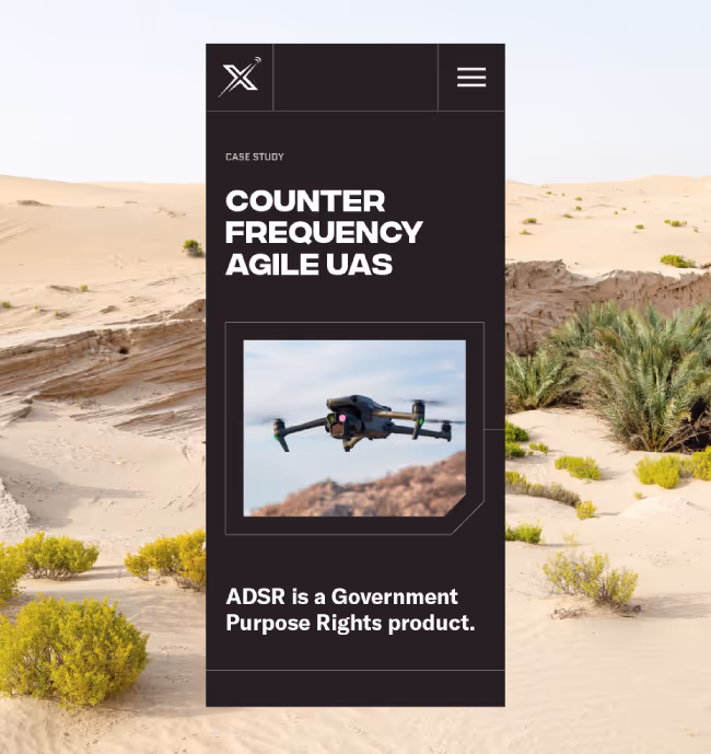 Mobile UI example of a product page which includes a drone flying over a desert landscape with sandy dunes and sparse vegetation.