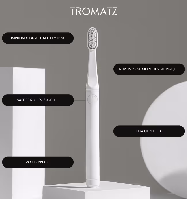 Social ad including a white electric toothbrush standing on a white pedestal with text highlighting features: improves gum health by 127%, removes 6x more dental plaque, safe for ages 3 and up, waterproof, FDA certified.