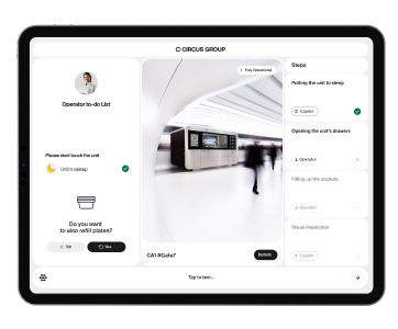 A tablet displaying the CIRCUS OS dashboard interface for managing CA-1 robotic kitchen operations, including sleep mode, refill options, and task status.