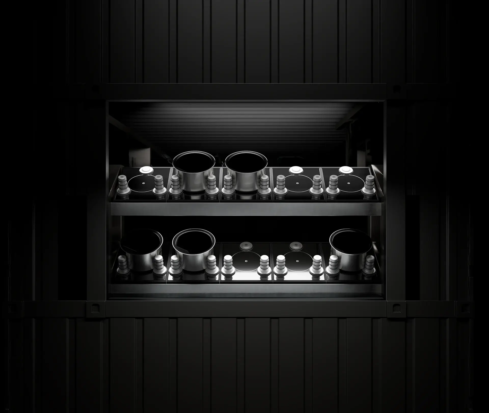 Interior view of the CA-M modular kitchen system showcasing multiple induction cooking units with stainless steel pots and precision-controlled dispensers.