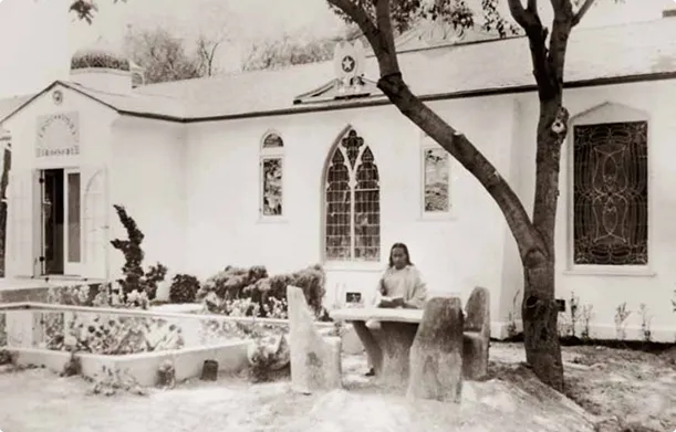 Paramahansa Yogananda sitting in the garden of the Self-Realization Fellowship Hollywood Temple.