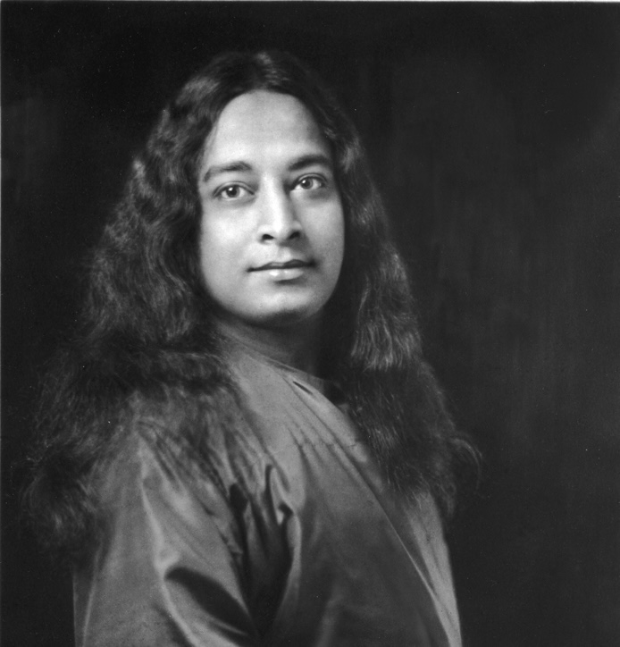 Black and white portrait of Paramahansa Yogananda
wearing a traditional robe.