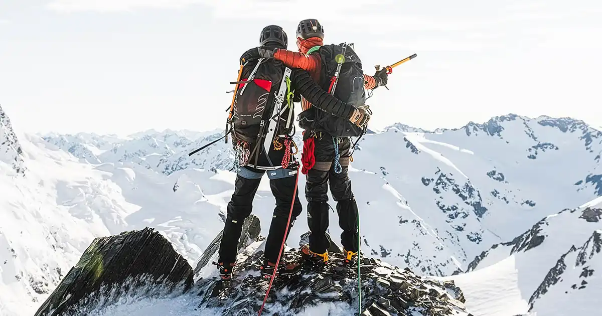 Guide and guest celebrates reaching the summit.