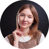 Circular portrait avatar of a smiling woman on a dark neutral background.