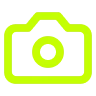 Green outlined camera icon with a circular lens detail in the center.
